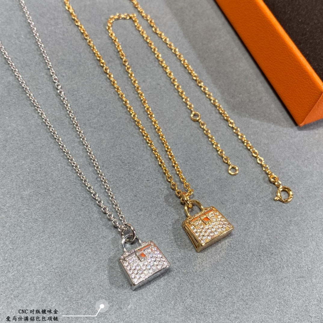 hermès fully Di*m*nd-encrusted bag necklace
